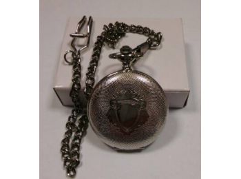 7451-2 Tiko Time zsebóra, pajzs